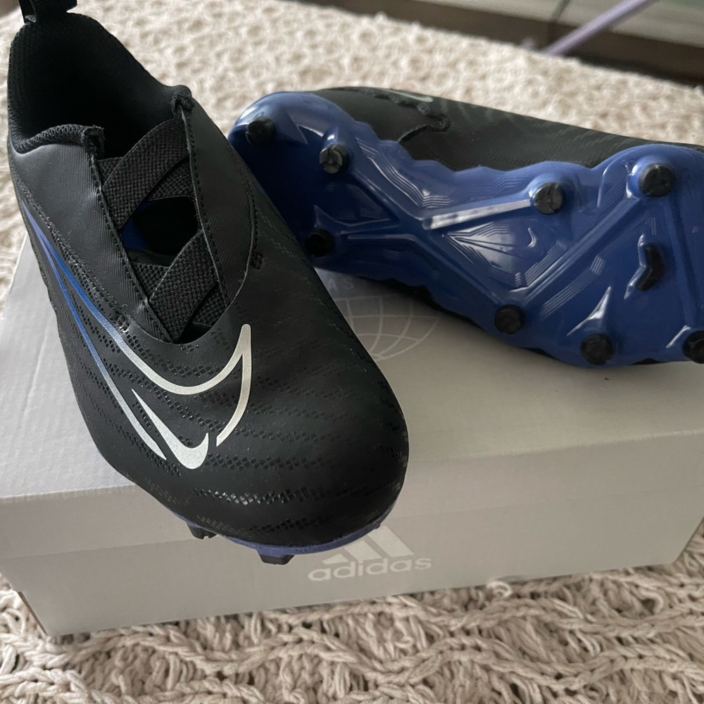 Nike Black Kids Soccer Cleats with Blue Soles
